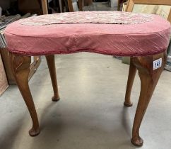 A 1930's kidney shaped dressing table stool