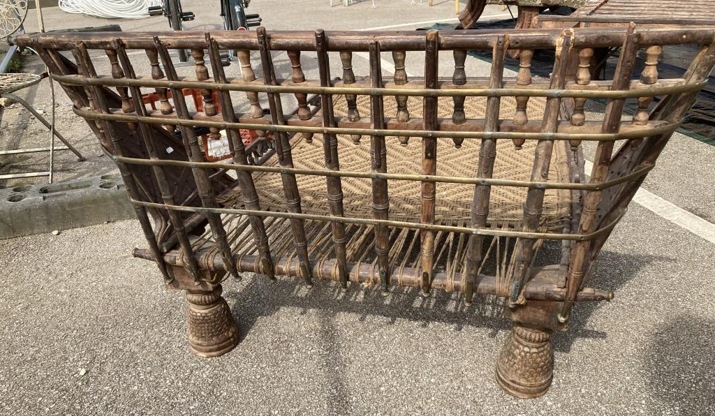 An Oriental style bed base 19th century with rope woven base and decorative metal rails and - Image 4 of 4