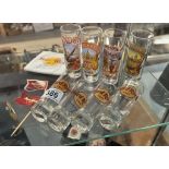 A collection of hard rock cafe glasses & reused items