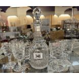 A cut-glass decanter & 2 sets of 4 cut glass drinking glasses (Don't match decanter)