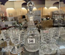A cut-glass decanter & 2 sets of 4 cut glass drinking glasses (Don't match decanter)