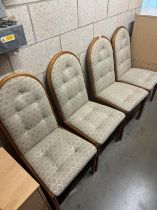 A set of 4 wood framed, upholstered dining chairs