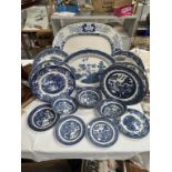 A quantity of blue & white dinner ware in blue willow & A blue & white ceramic meat plate