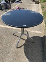 A Circular table with granite top