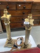 A pair of solid brass tall Corinthian column table lamps