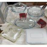 A quantity of Pyrex casserole dishes, flan tray, lidded pots etc