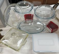 A quantity of Pyrex casserole dishes, flan tray, lidded pots etc