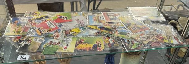 A collection of Bamforth comic series postcards. Approximately 40 in sleeves