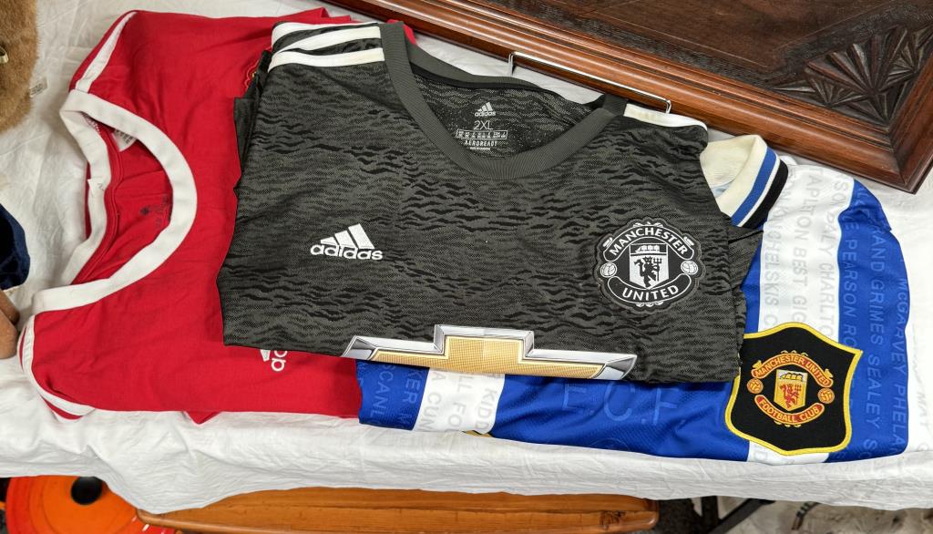 Three Manchester United shirts