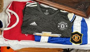 Three Manchester United shirts