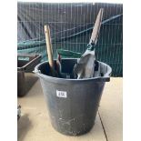 A quantity of gardening tools in a black plastic bucket