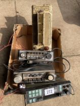 A vintage Dry Accumulator Charger plus three old car radios