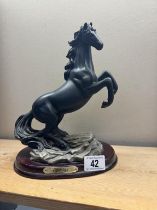 A resin ornament of a rearing horse