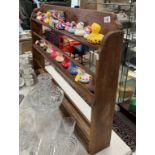 A wooden 3 shelf wall mounted plate display rack