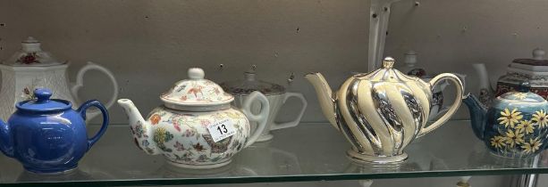A quantity of collectable teapots including Chinese, Sadler etc