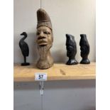 A carved wood African head & 3 others