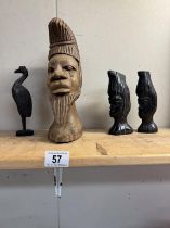A carved wood African head & 3 others