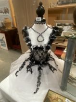 A mannequin model with gothic style attire