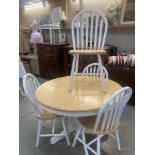 A dining table with 4 shabby chic painted chairs