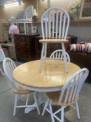 A dining table with 4 shabby chic painted chairs