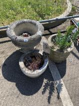 e3 Circular stone planters one with kestrel