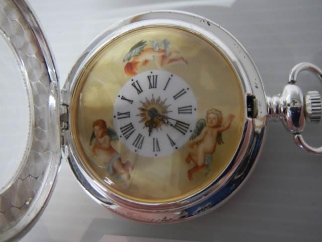 A 20th century silver plate pocket watch featuring cherubs, in working order. - Image 2 of 3