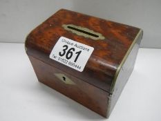 An early 20th century maple money box.