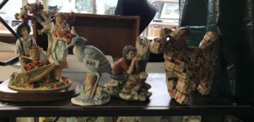 A collection of ceramics and decorative dog