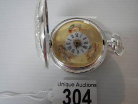 A 20th century silver plate pocket watch featuring cherubs, in working order.