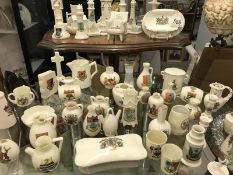 A quantity of ceramic items with city and town crests