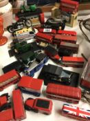 A collection of approx. 32 die cast cars, buses and motor bikes