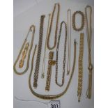 Ten pieces of yellow metal jewellery (chains, necklaces and brooches).