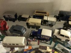 Three shelves of toy / model car.
