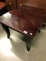 A small dark wooden table