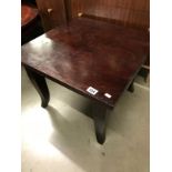 A small dark wooden table