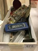 A box od miscellaneous items including harmonica, pill box etc