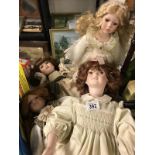 A collection of four porcelain dolls