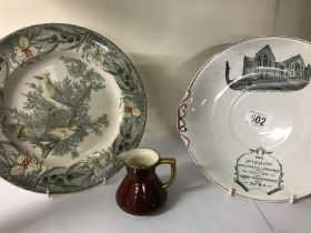 Two decorative plates and a jug