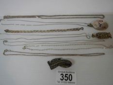 Five silver chains, a silver bracelet, silver pendant, marcasite brooch etc.,