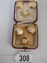 A set of six 20th century dress buttons.