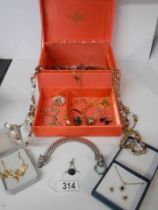 A 'Paris' jewellery box with a mixed lot of costume jewellery.