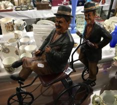 Laurel and hardy figures on tricycle
