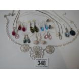 A quantity of good quality earrings (some silver) and a pendant.