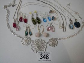 A quantity of good quality earrings (some silver) and a pendant.