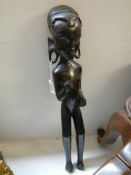 A carved wood tribal figure.
