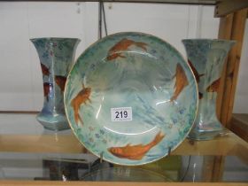 An unusual Burleigh ware bowl decorated with fish and a pair of matching vases.