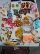 A mixed lot of costume jewellery including necklaces, brooches etc.,