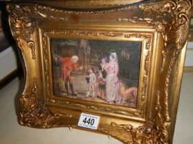 A small gilt framed family scene.