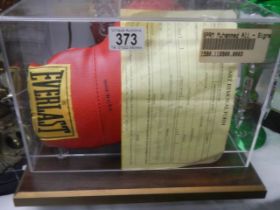 A cased Muhammad Ali signed boxing glove with certificate, COLLECT ONLY.