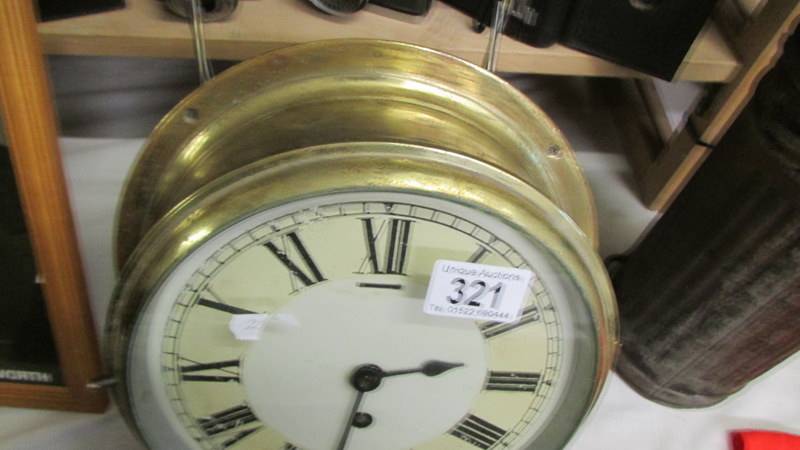 A brass ship's clock. - Image 2 of 2